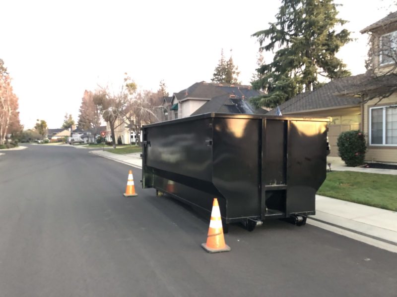 dumpster ready for dumpster rentals by toss out junk removal